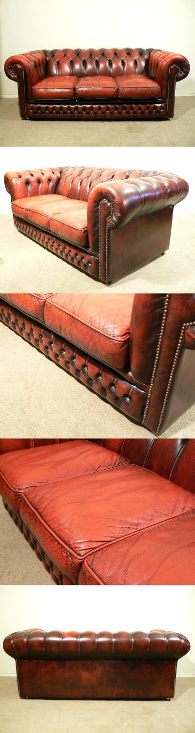 A three seater red leather Chesterfield sofa, c1980.  